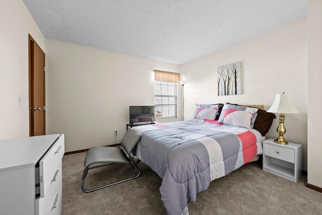 carpeted bedroom featuring a textured ceiling