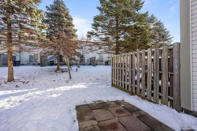 view of yard layered in snow