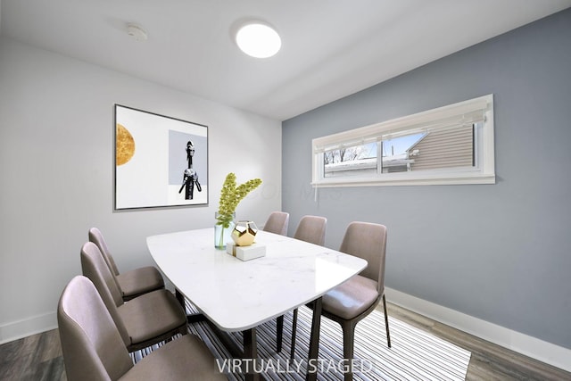 dining space featuring dark wood-type flooring