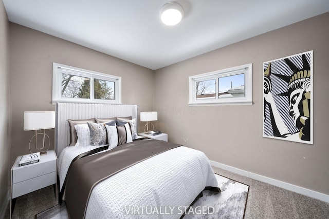 carpeted bedroom with multiple windows