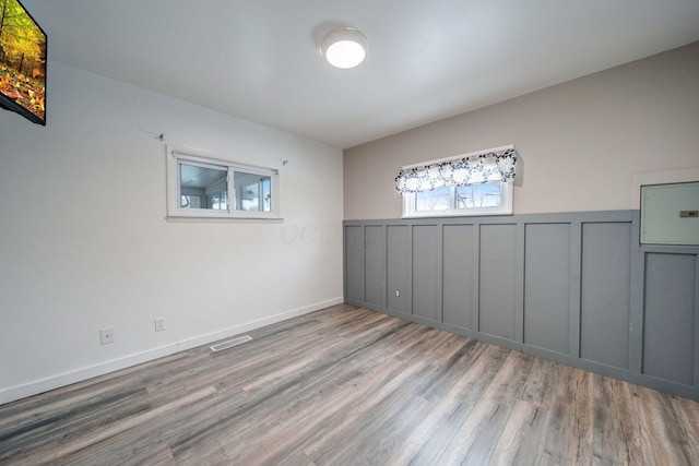 spare room featuring light hardwood / wood-style flooring