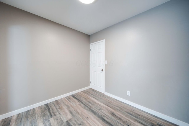 unfurnished room with light hardwood / wood-style flooring