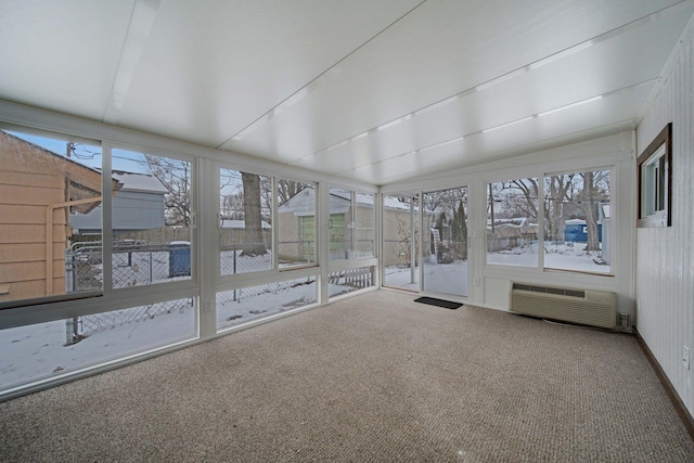 unfurnished sunroom featuring a wall mounted air conditioner