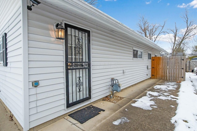 view of snow covered property entrance