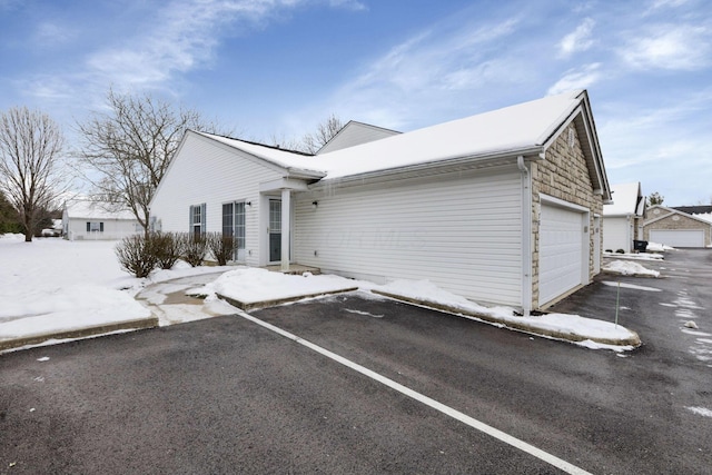 ranch-style home featuring a garage