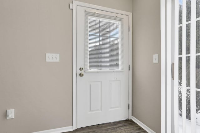 doorway with dark wood-type flooring