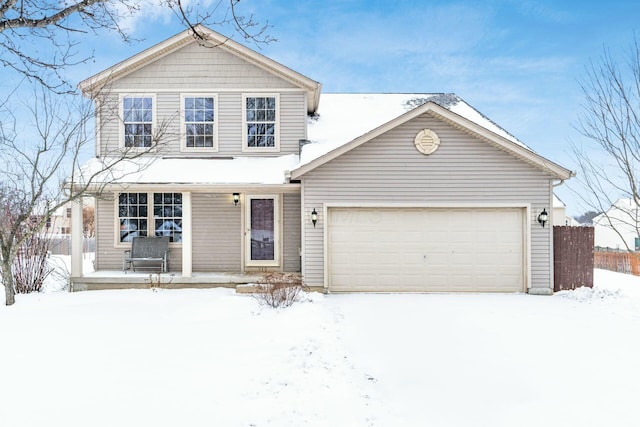 front facade featuring covered porch and a garage