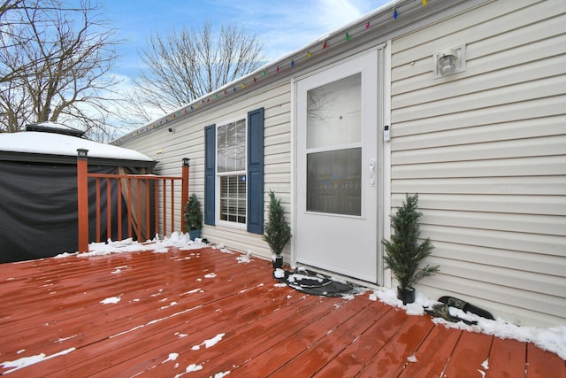 view of snow covered deck