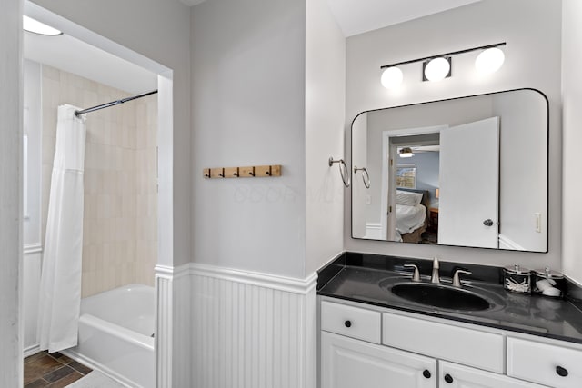 bathroom with shower / bath combination with curtain and vanity