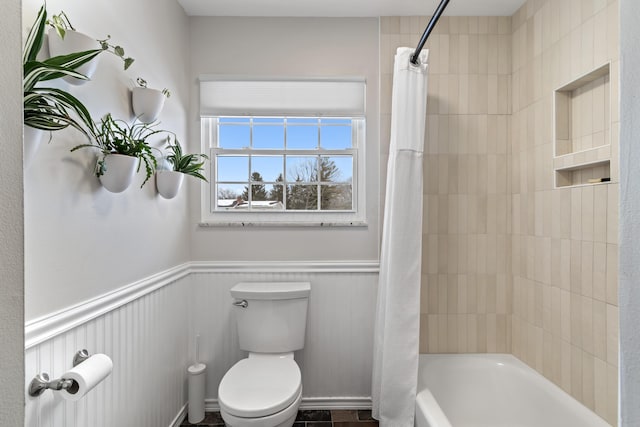 bathroom with toilet and shower / bathtub combination with curtain