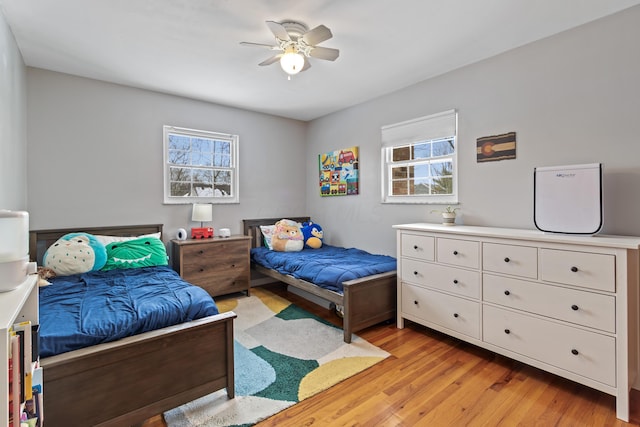 bedroom featuring ceiling fan and light hardwood / wood-style floors