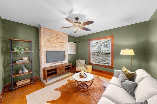 living room with ceiling fan and hardwood / wood-style floors