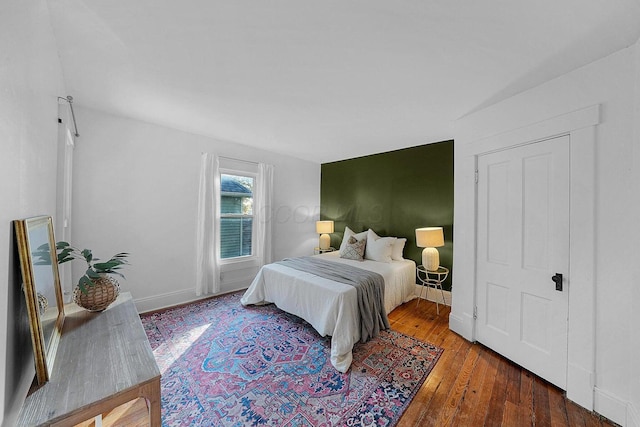 bedroom with hardwood / wood-style floors