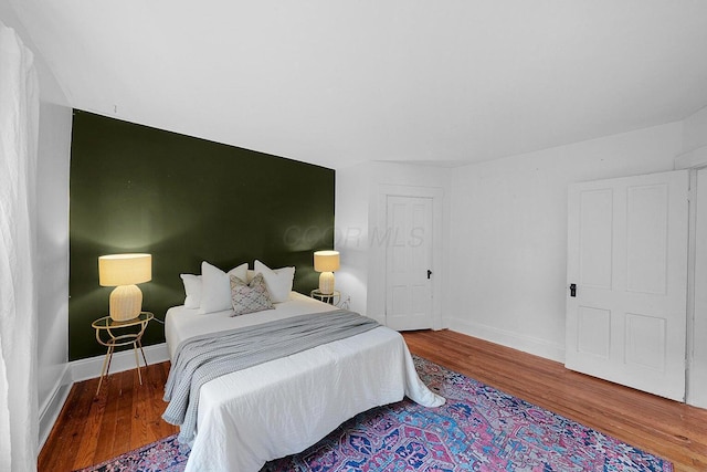 bedroom with hardwood / wood-style floors