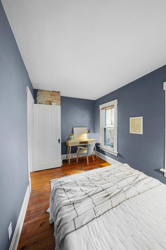 bedroom featuring hardwood / wood-style floors