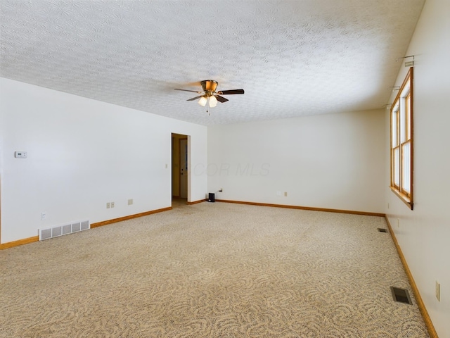 unfurnished room featuring a textured ceiling and ceiling fan