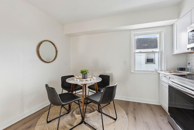 dining room featuring light wood-type flooring