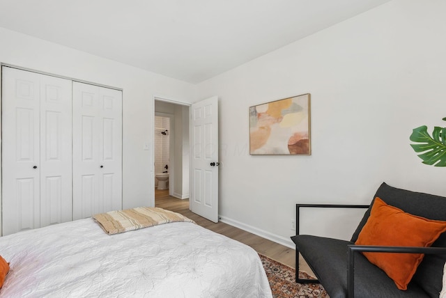 bedroom featuring hardwood / wood-style flooring and a closet