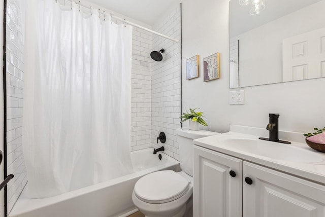 full bathroom with vanity, shower / bath combo, and toilet