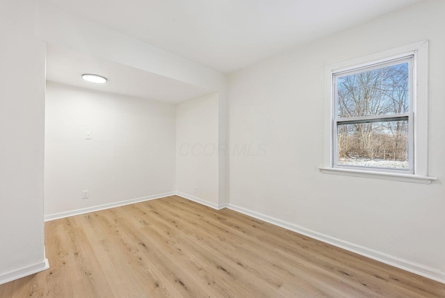 unfurnished room with light hardwood / wood-style flooring