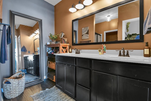 bathroom featuring vanity and hardwood / wood-style floors