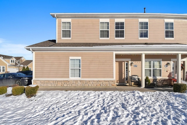 view of snow covered property