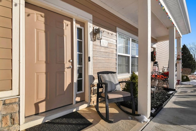 entrance to property with a porch