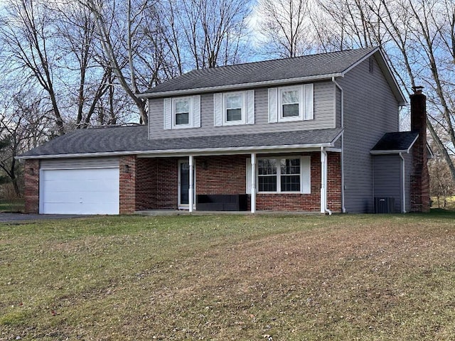 front of property with a front yard and a garage