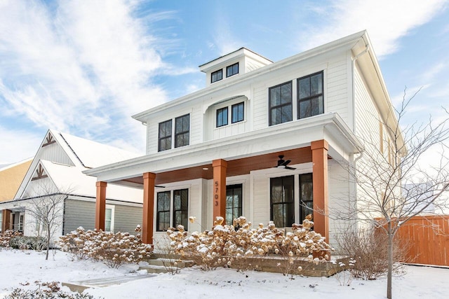 view of front facade featuring ceiling fan and covered porch