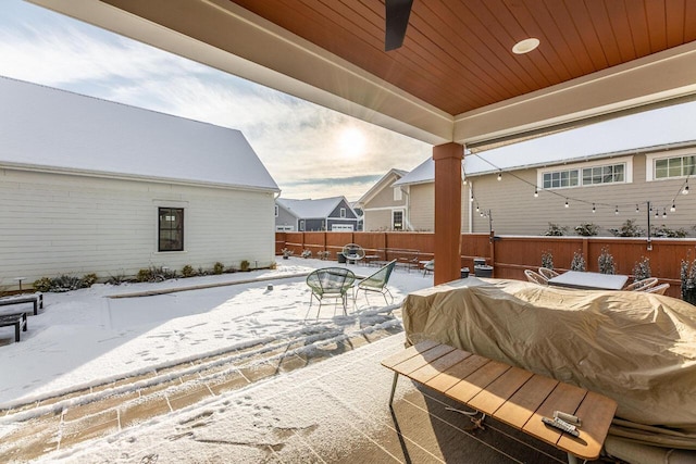 view of snow covered patio