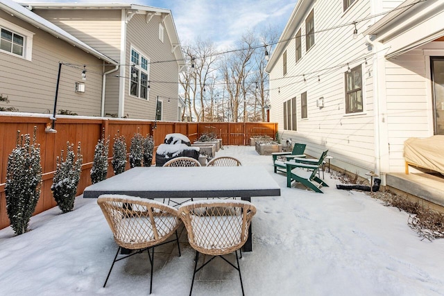 view of snow covered patio