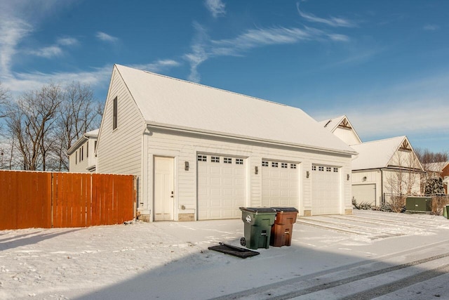 view of snow covered garage