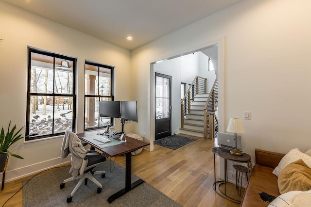 office space with light wood-type flooring