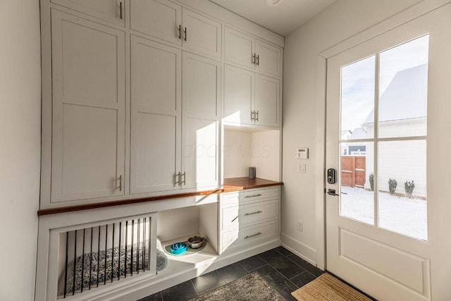 interior space with built in desk and a wealth of natural light