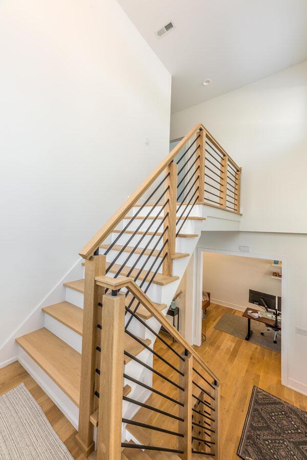 stairs with hardwood / wood-style flooring