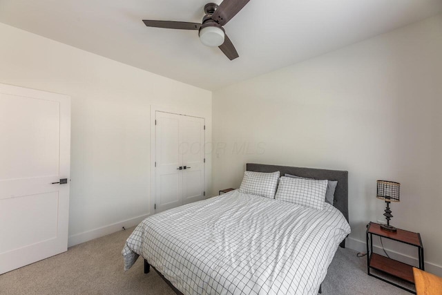 bedroom with light carpet and ceiling fan