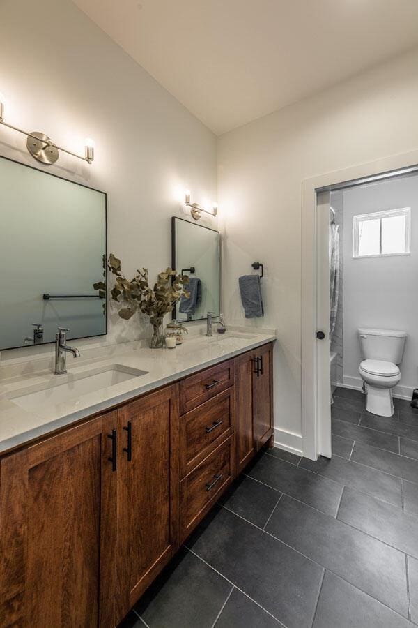 full bathroom with vanity, tile patterned flooring, shower / bath combination with curtain, and toilet