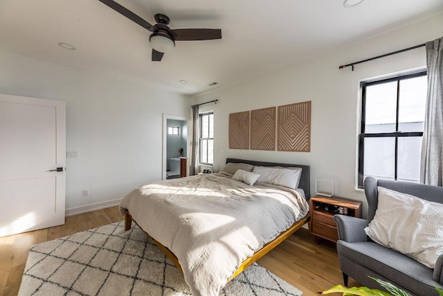 bedroom with ceiling fan and light wood-type flooring