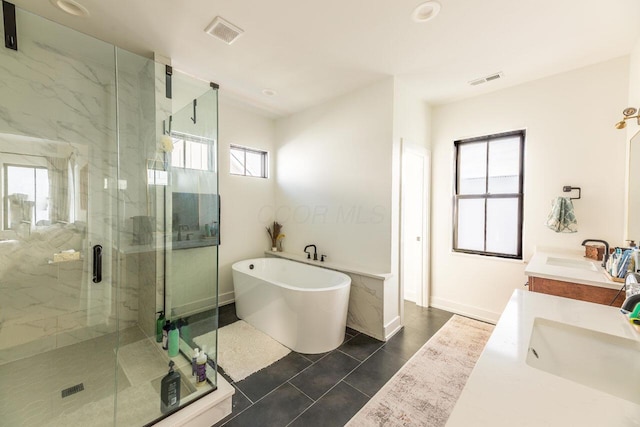 bathroom featuring vanity, tile patterned flooring, and independent shower and bath