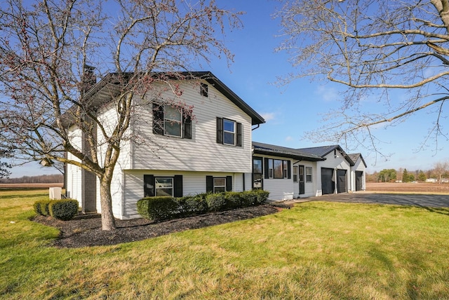 split level home featuring a front lawn