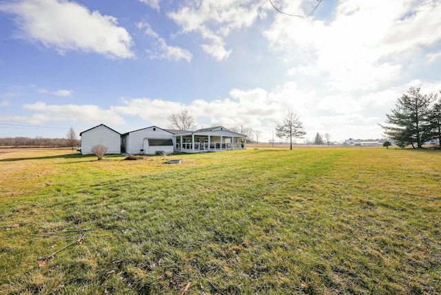 view of yard with a rural view