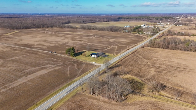 birds eye view of property with a rural view