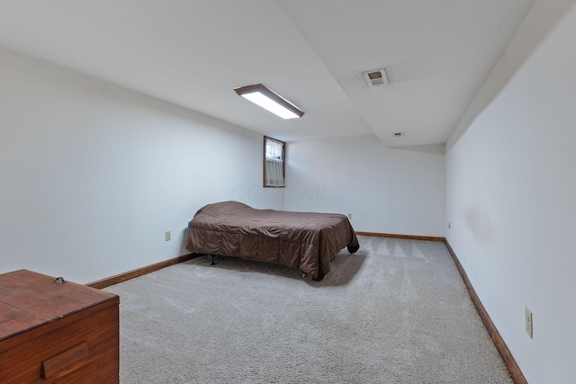 bedroom with light carpet