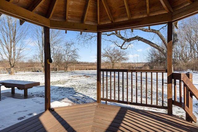 snow covered deck featuring a gazebo