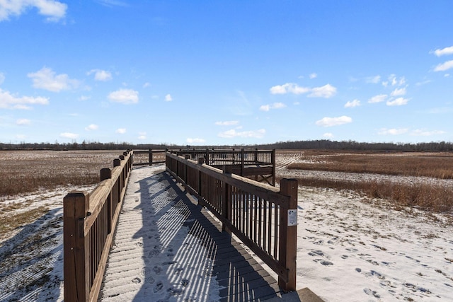 view of dock with a rural view