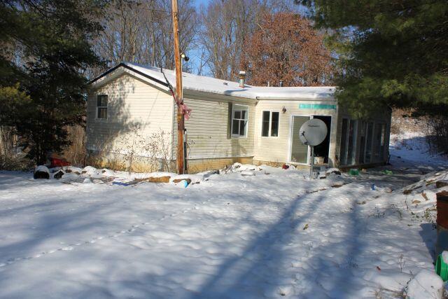 view of snow covered house