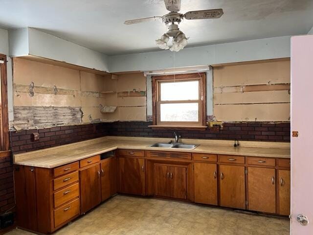 kitchen featuring sink and ceiling fan