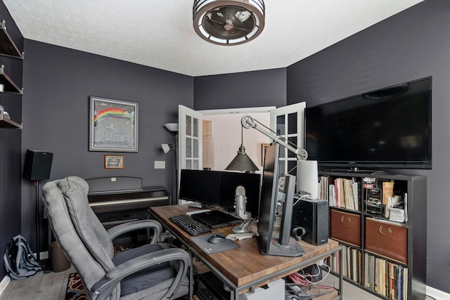 office featuring a textured ceiling and wood-type flooring