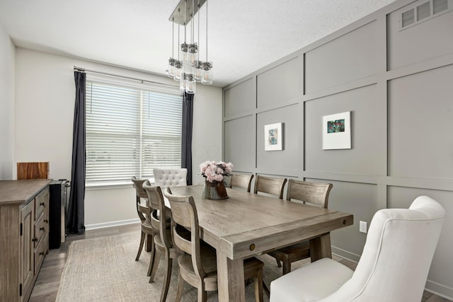 dining space with light wood-type flooring