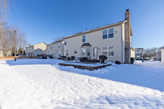 view of snow covered property